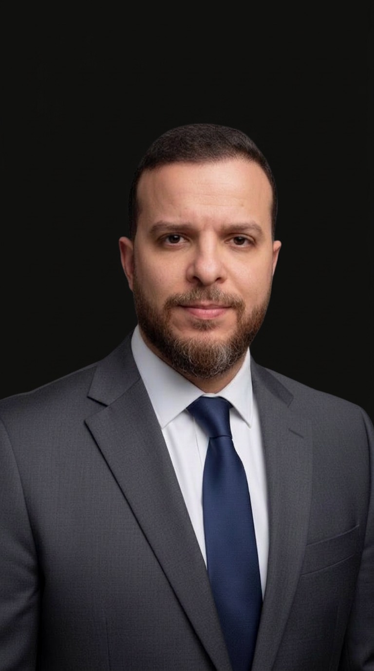 Mohammed Mansour in a gray suit